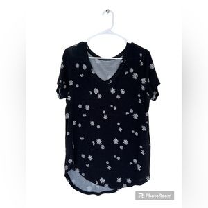 Black t-shirt with white flowers.